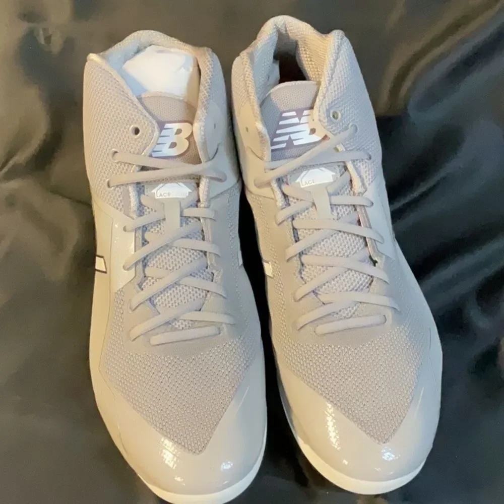 New Balance Gray and White Men's Athletic Cleats.  16 2E Wide